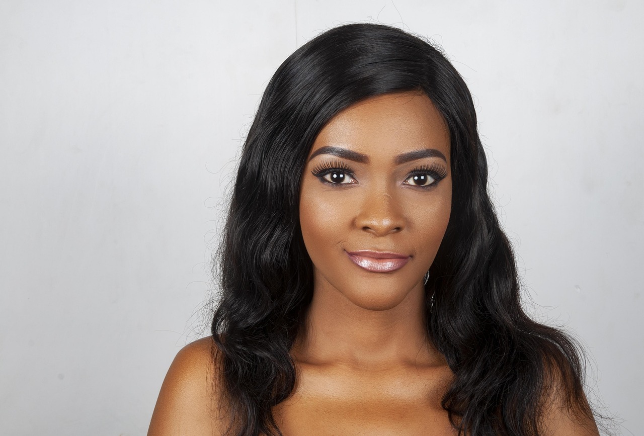 Woman with long dark hair and polished makeup